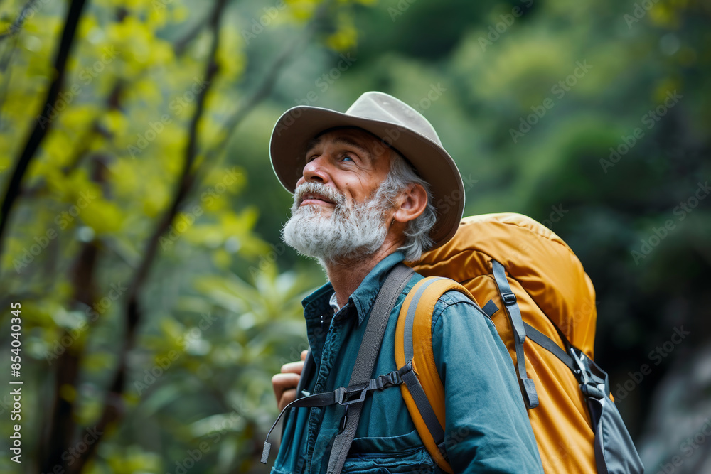 Senior Man Hiking with Backpack in Forest - Adventure and Nature Exploration Senior Man Hiking with Backpack in Forest - Adventure and Nature Exploration