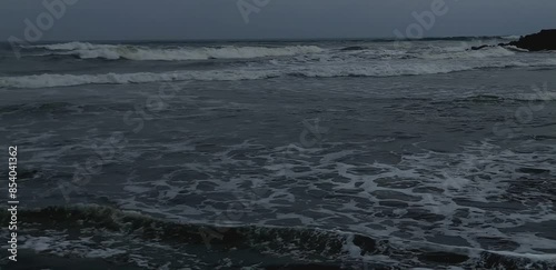 waves crashing on a beautiful beach in the afternoon