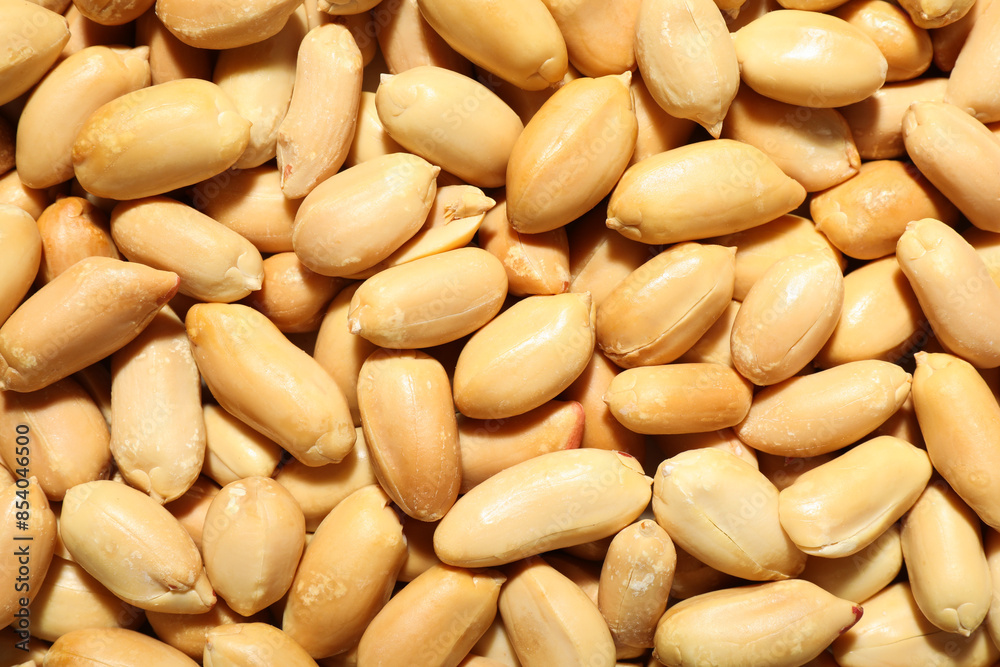 Fresh peeled peanuts as background, top view Fresh peeled peanuts as background, top view