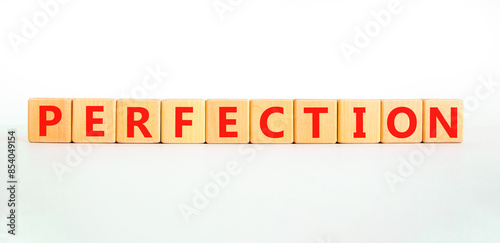 Perfection symbol. Concept word Perfection on beautiful wooden blocks. Beautiful white background. Business perfection concept. Copy space.