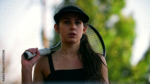 Woman tennis player posing for a photo