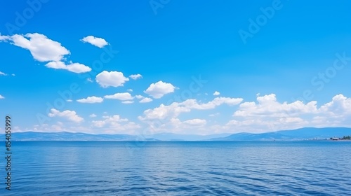 Wallpaper Mural Endless vast blue horizons  panoramic sea and sky view with white clouds stretching infinitely Torontodigital.ca