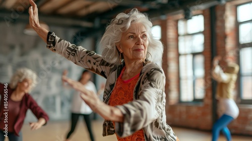 Elderly woman leading a hip-hop dance class, showing off her moves