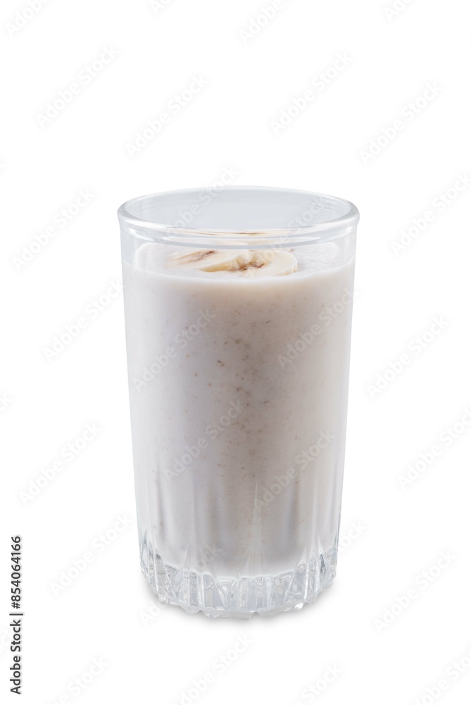Banana milkshake with banana slices in a glass on a white isolated background Banana milkshake with banana slices in a glass on a white isolated background