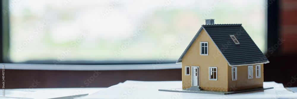 Property investment concept, image of small house model on the table. Property investment concept, image of small house model on the table.