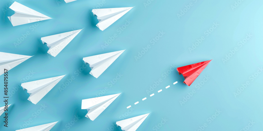 Solo red paper plane changing course