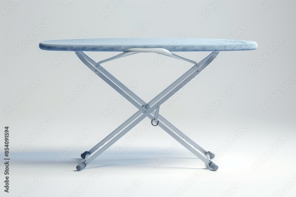 A blue ironing board sitting on a table, ready for use A blue ironing board sitting on a table, ready for use