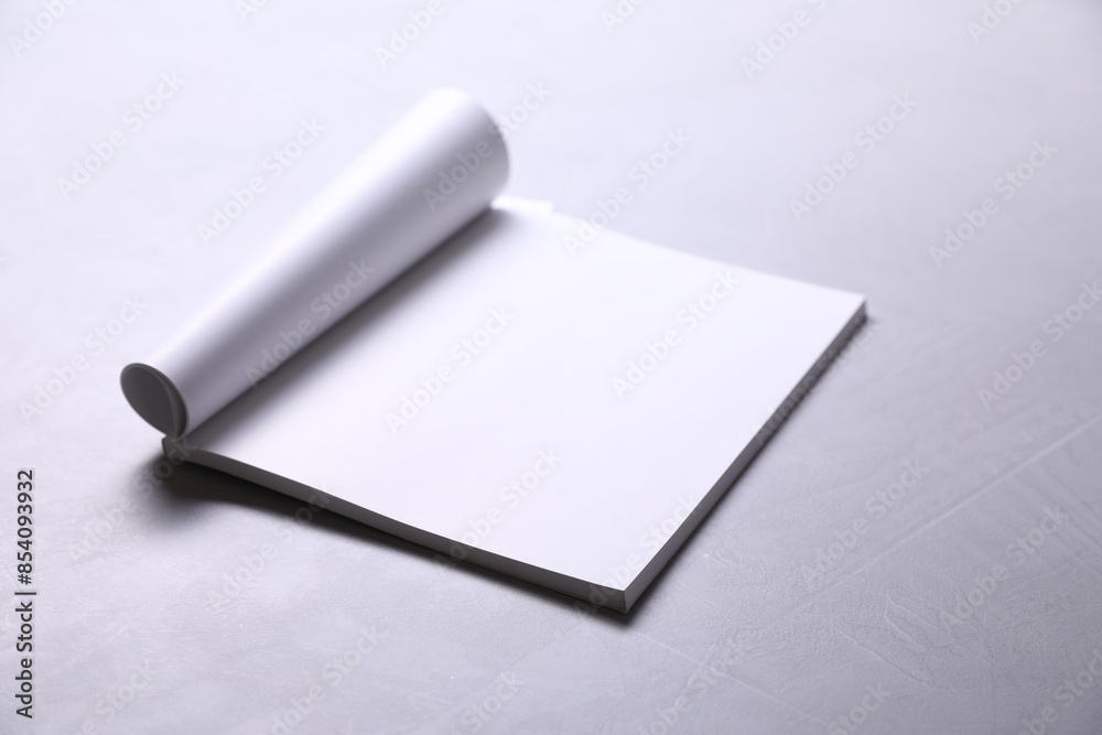 Blank paper sheets on grey textured table. Mockup for design Blank paper sheets on grey textured table. Mockup for design