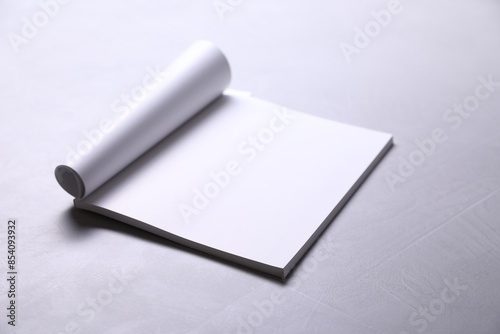 Wallpaper Mural Blank paper sheets on grey textured table. Mockup for design Torontodigital.ca