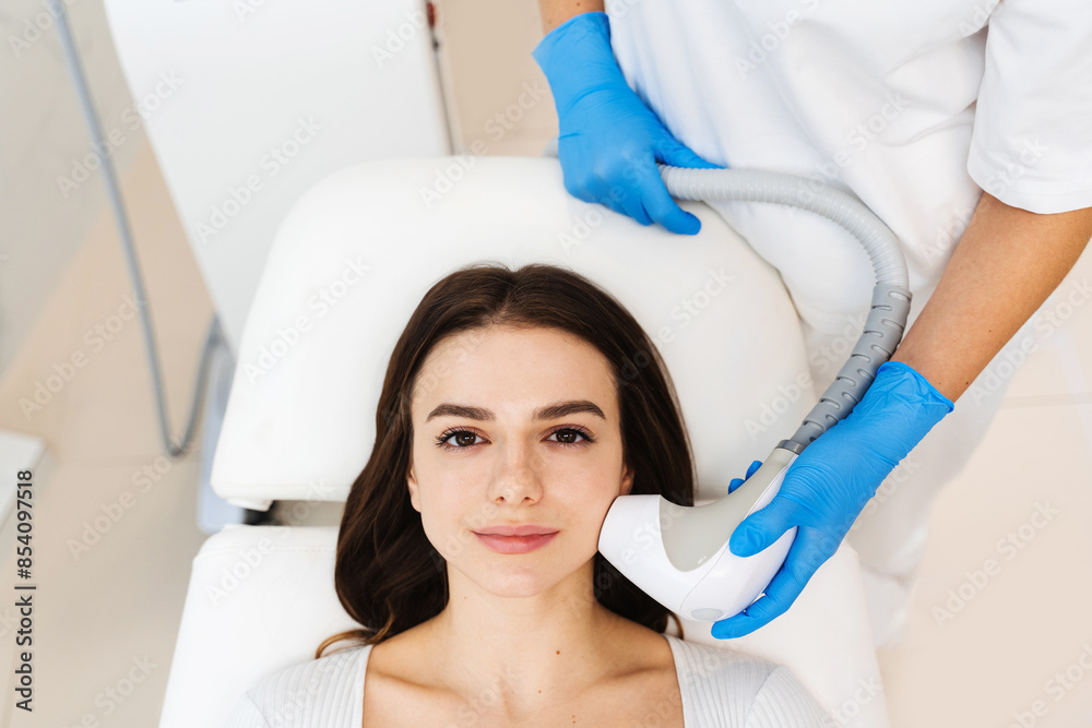 Process of needle-free rf-lifting when you need to tighten your face shape without injections. Hardware cosmetology procedure. Process of needle-free rf-lifting when you need to tighten your face shape without injections. Hardware cosmetology procedure.
