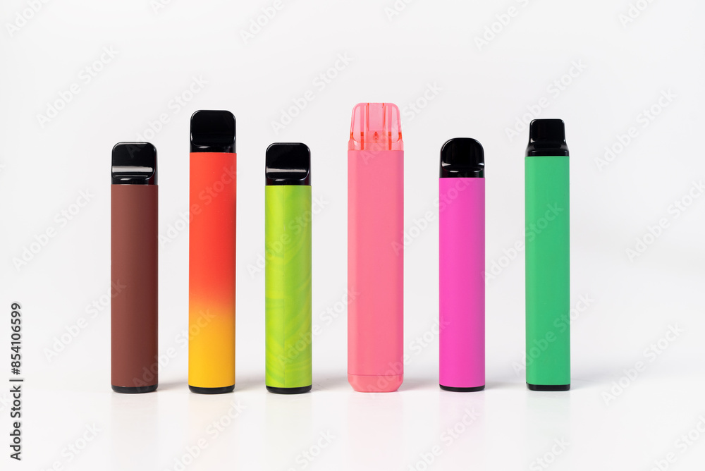 A set of colorful disposable electronic cigarettes of different shapes on a white background. modern smoking.
A set of colorful disposable electronic cigarettes of different shapes on a white background. modern smoking.