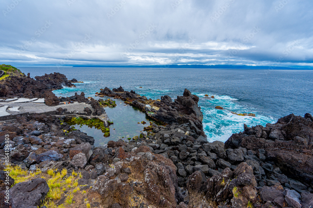 Area of natural pools with color contrasts in the parish of Saoo Roque on the island of Pico in the Azores archipelago.