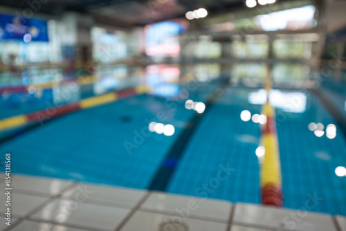 Wallpaper Mural Defocused empty sport competition swimming pool with lanes, lens blur Torontodigital.ca