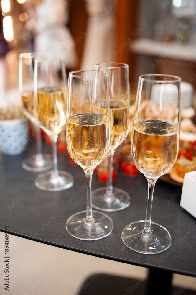 Wine tasting. Sommelier pours wine into a glass Wine tasting. Sommelier pours wine into a glass