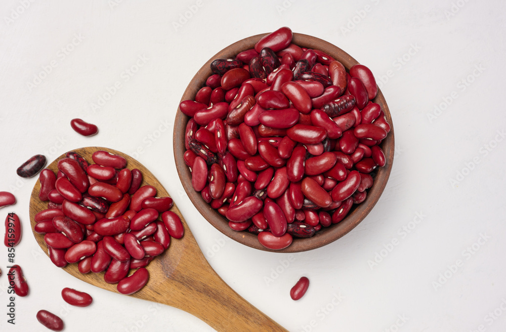 Raw red beans in a plate on the table, top view. Raw red beans in a plate on the table, top view.