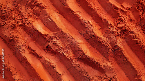 Flat image of red sand viewed from above. Sand texture.