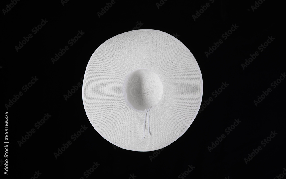 white women's wide-brimmed hat isolated on black background white women's wide-brimmed hat isolated on black background