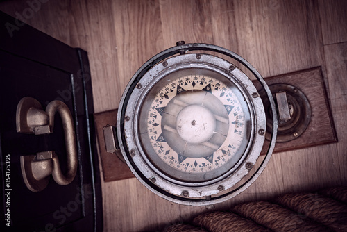 old and vintage ship's compass photo
