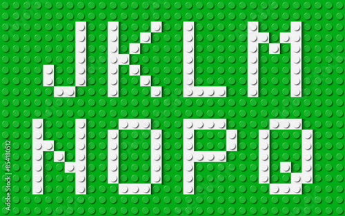 Letters of the alphabet composed of white plastic brick toy blocks on green construction plate. Building bricks font. Vector background illustration