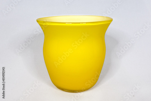 yellow glass vase on a white background