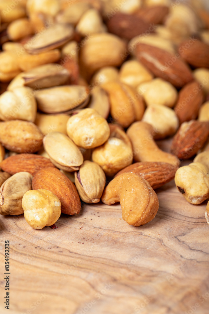 Mixed nuts on wooden background. Close up Mixed nuts on wooden background. Close up