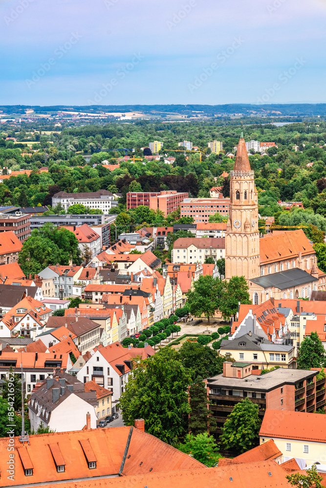 Obraz premium Panoramic view, aerial skyline of Landshut in Bavaria. Saint Martin cathedral, Martinskirch in old town and cathedrals, architecture, roofs of houses, streets landscape, Landshut, Germany. Vertical