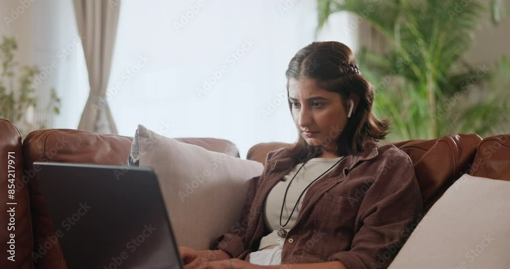 Woman, laptop and online stream with internet, browse and social media for networking. Student, technology and remote education for research, video and podcast for learning or study with music Woman, laptop and online stream with internet, browse and social media for networking. Student, technology and remote education for research, video and podcast for learning or study with music