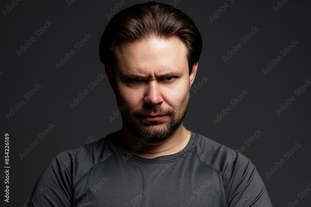 Fototapeta premium Very angry man portrait on dark background