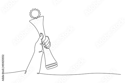 Hand holding winner trophy continuous one line icon drawing. Award trophy cup single line vector illustration in doodle style. Champions celebration contour linear sign design concept