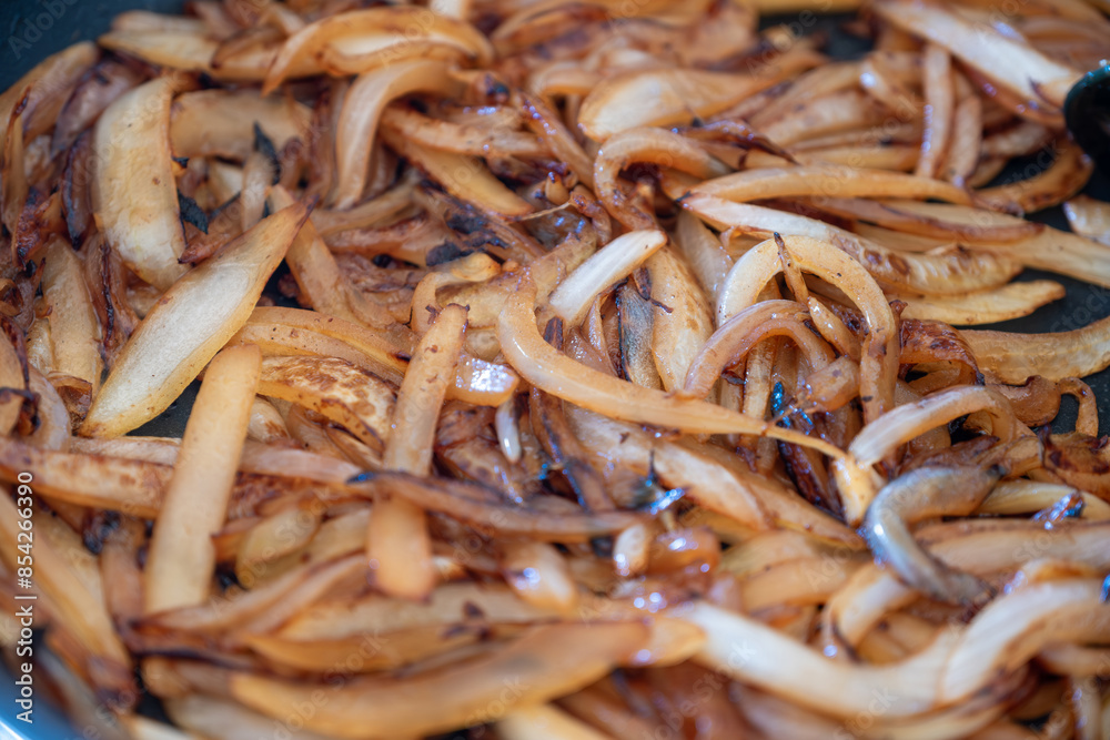 the preparation and cooking process of onions, highlighting various techniques and states, such as sautéed, roasted, caramelized, and the use of kitchen tools like skillets and frypans the preparation and cooking process of onions, highlighting various techniques and states, such as sautéed, roasted, caramelized, and the use of kitchen tools like skillets and frypans