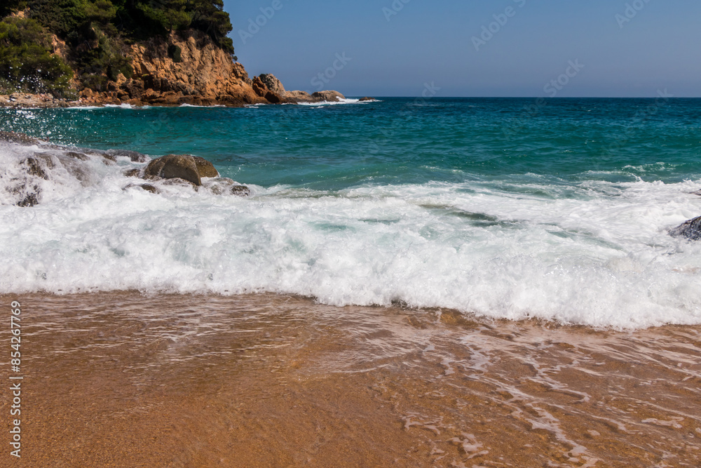 beach in Cala Sa Boadella Bay, Costa Brava, Lloret de Mar, Catalonia, Spain. Beautiful seascape. huge waves beach in Cala Sa Boadella Bay, Costa Brava, Lloret de Mar, Catalonia, Spain. Beautiful seascape. huge waves