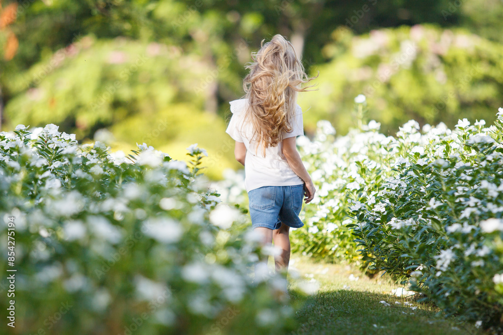 Caucasian white little girl playing at the park in morning. Caucasian white little girl playing at the park in morning.