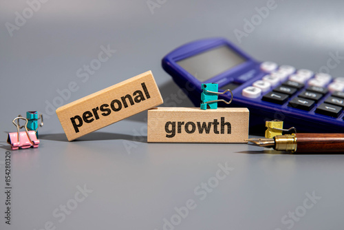 PERSONAL GROWTH text on paper clipboard with chart photo