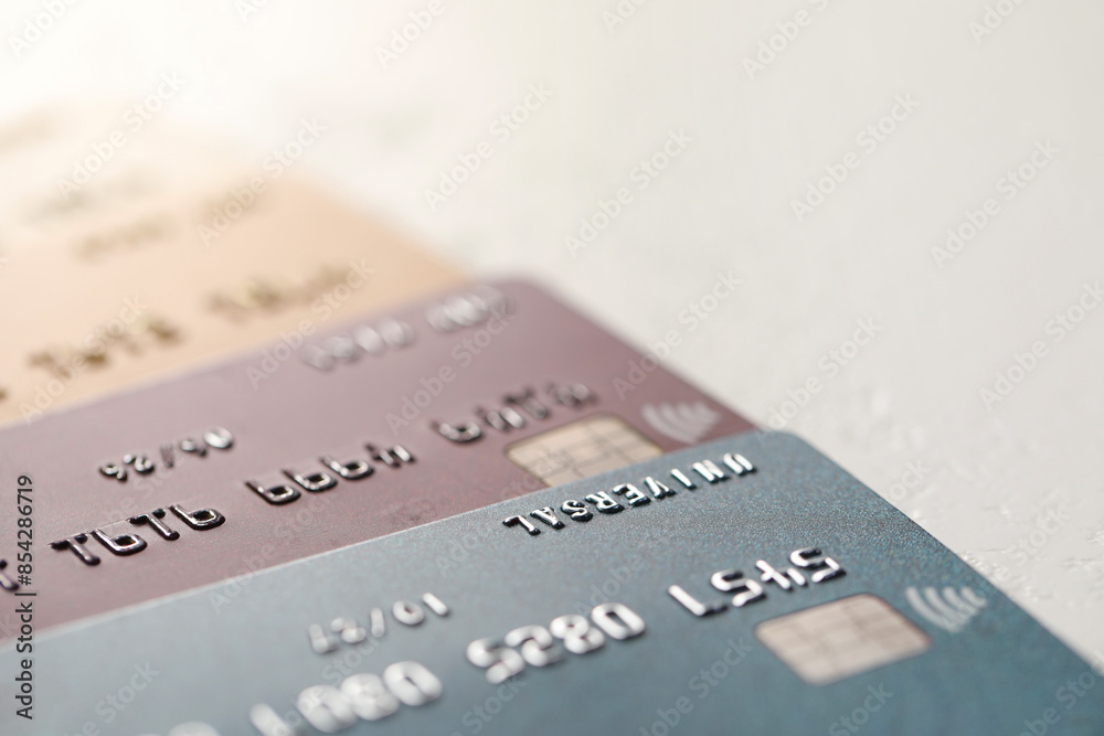 Many credit cards on gray background, closeup Many credit cards on gray background, closeup