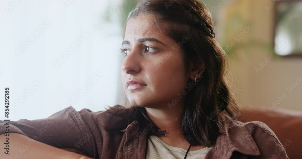 Depression, thinking and sad woman on sofa with mistake anxiety, regret or mental health disaster at home. Nervous, fail or girl with broken heart in living room with fear, trauma or conflict guilt