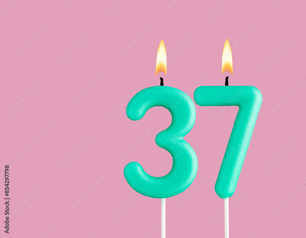 Green candle number 37 - Birthday card on pastel pink background Green candle number 37 - Birthday card on pastel pink background