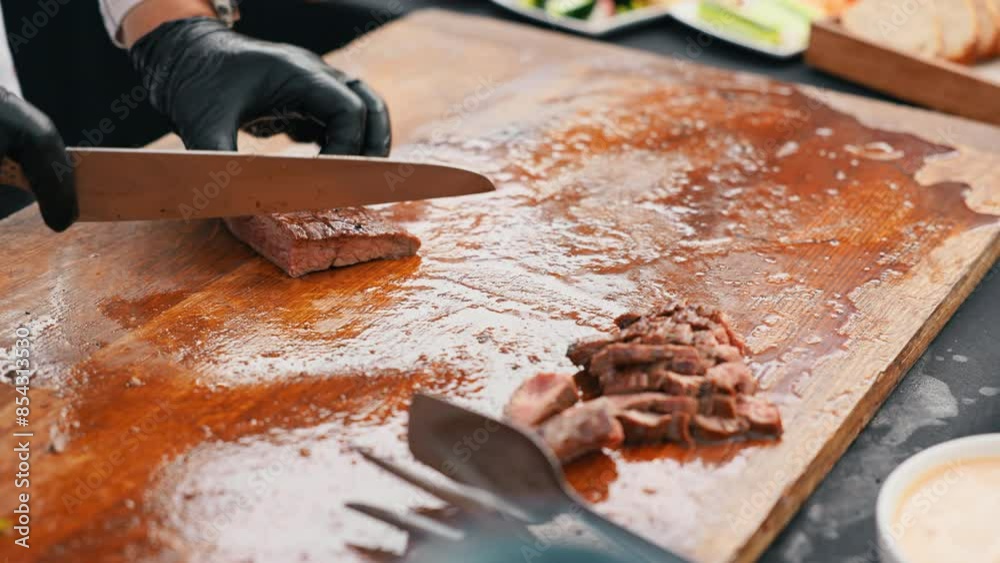 Mesmerizing slow motion video perfectly cooked steak being sliced on wooden cutting board, culinary pleasure Mesmerizing slow motion video perfectly cooked steak being sliced on wooden cutting board, culinary pleasure