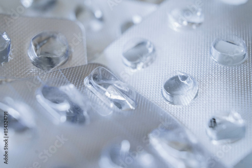 Used empty packaging from pills close up. Many different pill blister silver pharmaceutical packaging foils. Drug shortage concept.