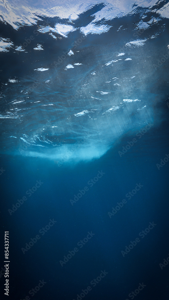 Naklejka premium Underwater Art for your interior design. Sunlight rays in the blue ocean