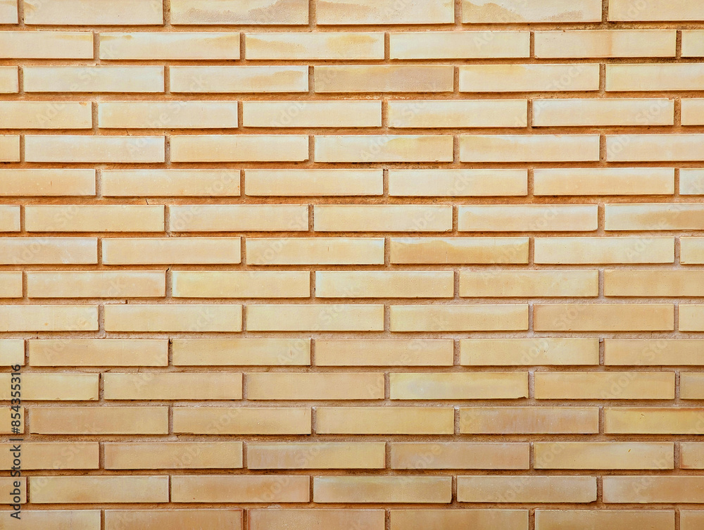 Modern elegant smooth cream yellow brick exterior wall texture or background. Modern elegant smooth cream yellow brick exterior wall texture or background.