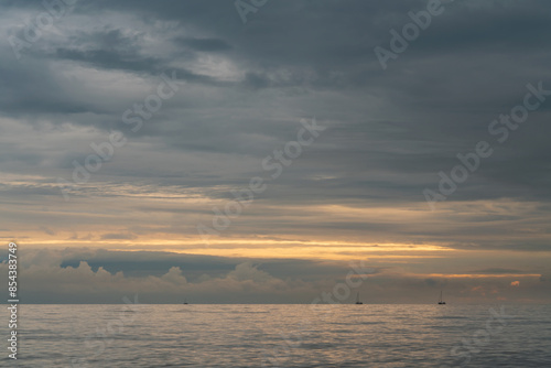 View of the Black Sea on the coast of Sochi against the sunset sky, Sochi, Krasnodar Krai, Russia photo