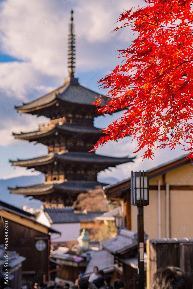 Yasaka Pagoda view and Hokan-ji Temple from Yasaka Dori street in Kyoto, Japan. Popular touristic street leading to Kyomizu Dera, Ninenzaka and Sennenzaka, In the evening, the sunset, cherry blossoms. Yasaka Pagoda view and Hokan-ji Temple from Yasaka Dori street in Kyoto, Japan. Popular touristic street leading to Kyomizu Dera, Ninenzaka and Sennenzaka, In the evening, the sunset, cherry blossoms.