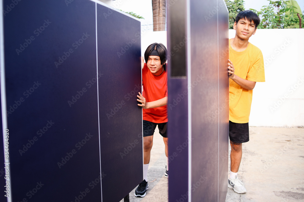 Two Young Asian Man Pushing Ping Pong Table To Search Position For Playing Ping Pong. Preparation Ping Pong Table Two Young Asian Man Pushing Ping Pong Table To Search Position For Playing Ping Pong. Preparation Ping Pong Table