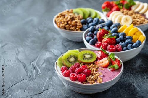 Healthy breakfast setup with smoothie bowls, fresh fruits, and granola, colorful and appetizing, bright and natural lighting
