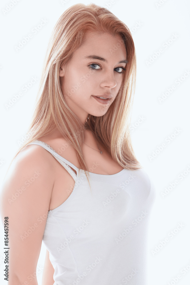 Attractive young woman with long blonde hair posing on white bac Attractive young woman with long blonde hair posing on white bac