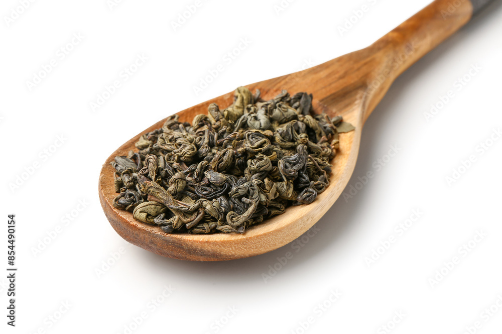 Wooden spoon with dry green tea leaves on white background Wooden spoon with dry green tea leaves on white background