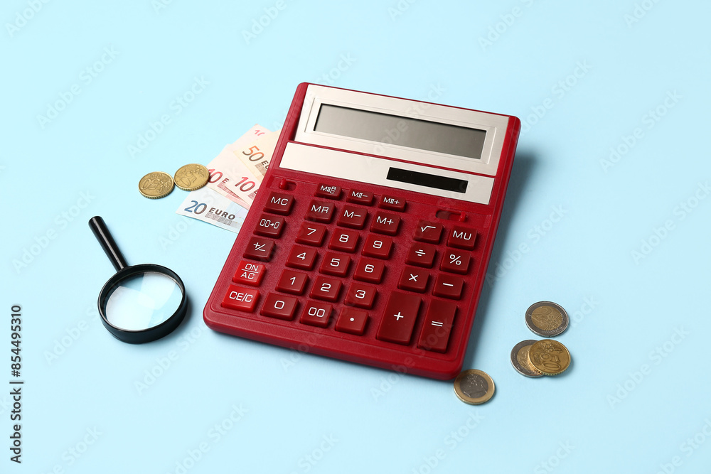 Calculator with money and magnifying glass on blue background. Calculator with money and magnifying glass on blue background.