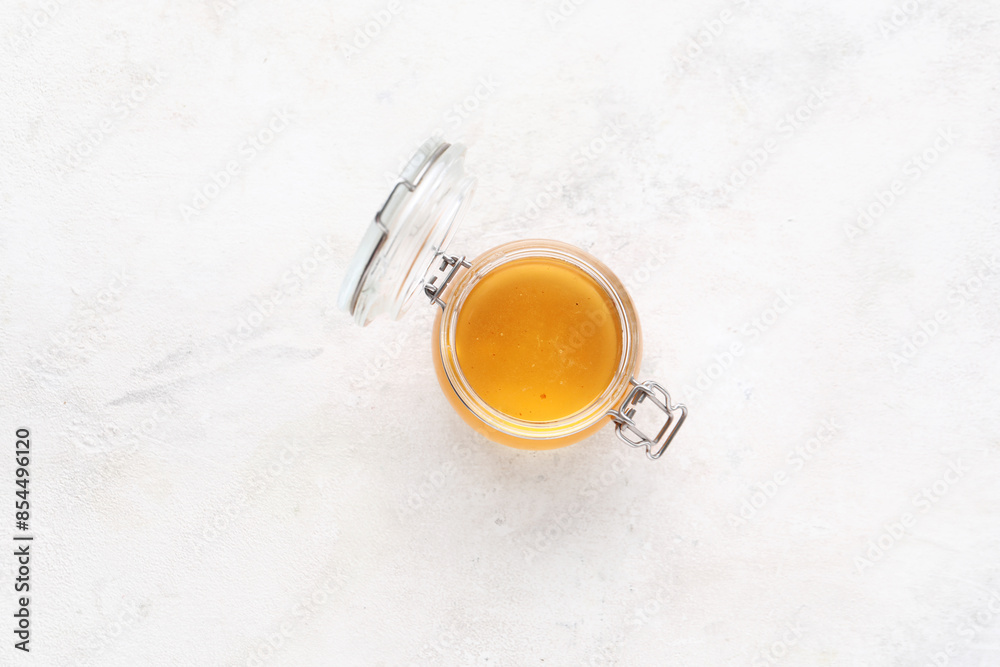 Jar with sweet honey on white background Jar with sweet honey on white background