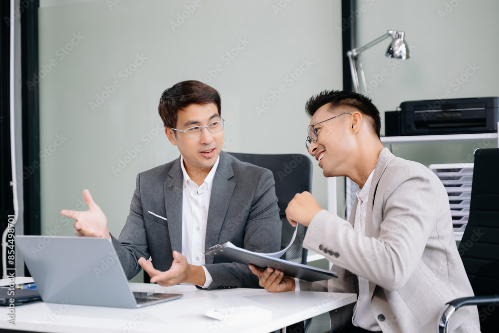 Portrait of success business people working together in modern office. Couple teamwork startup concept
