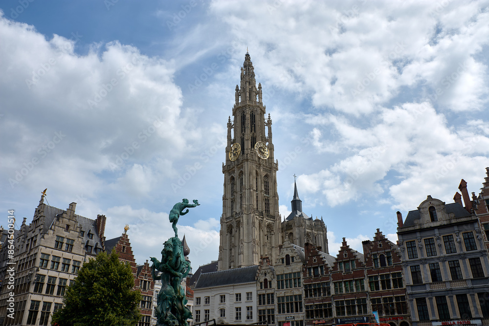 Fototapeta premium View of the gothic cathedral of Our Lady in Antwerp Belgium with gold clock